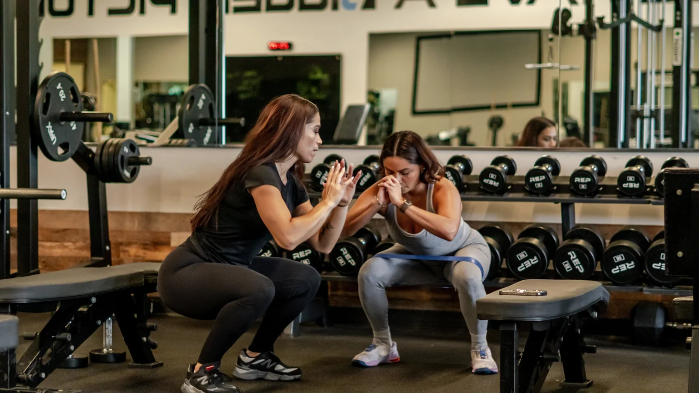 Kayla coaching a client
